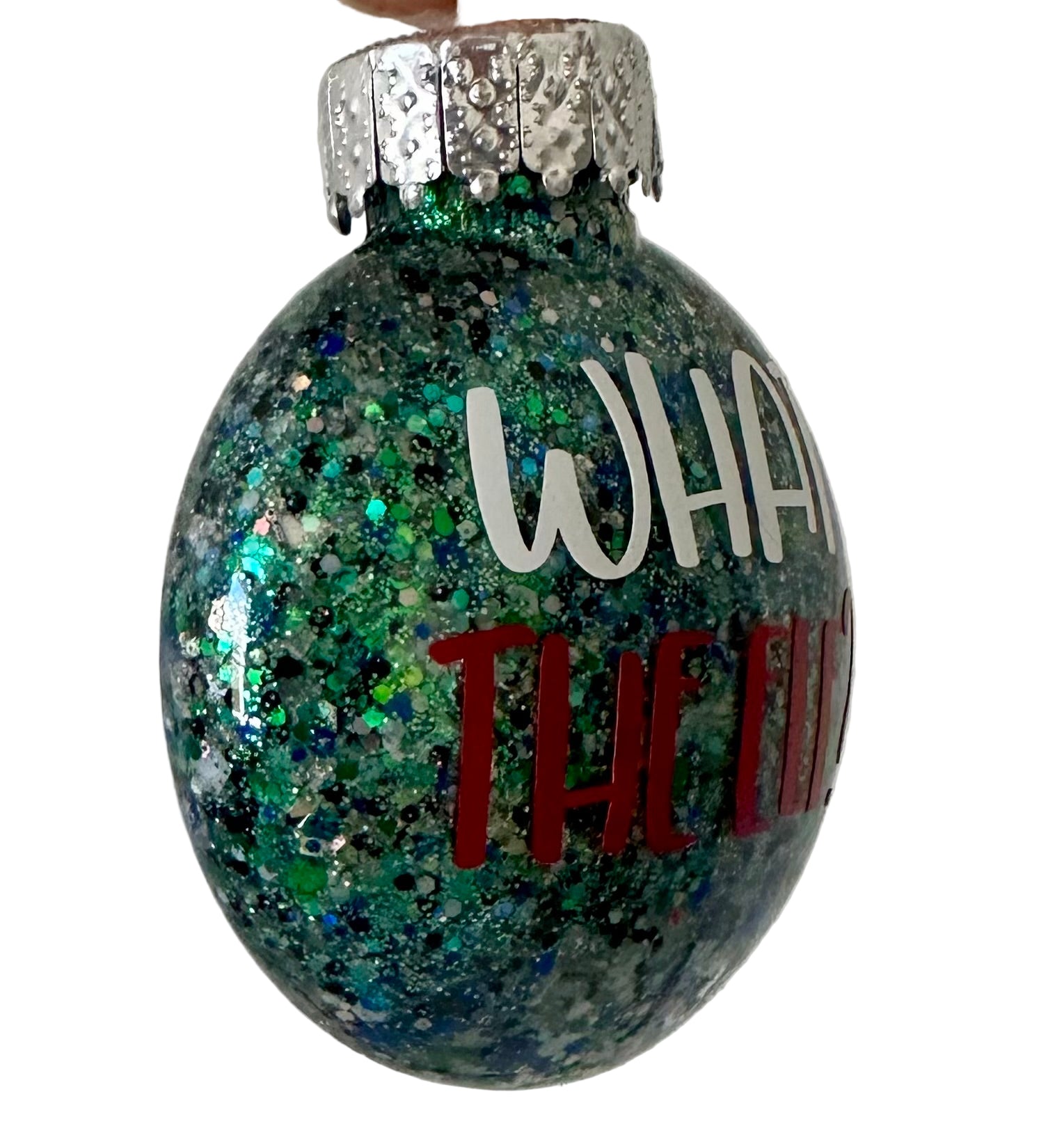 Funny flat ornament with What the Elf phrase and festive design