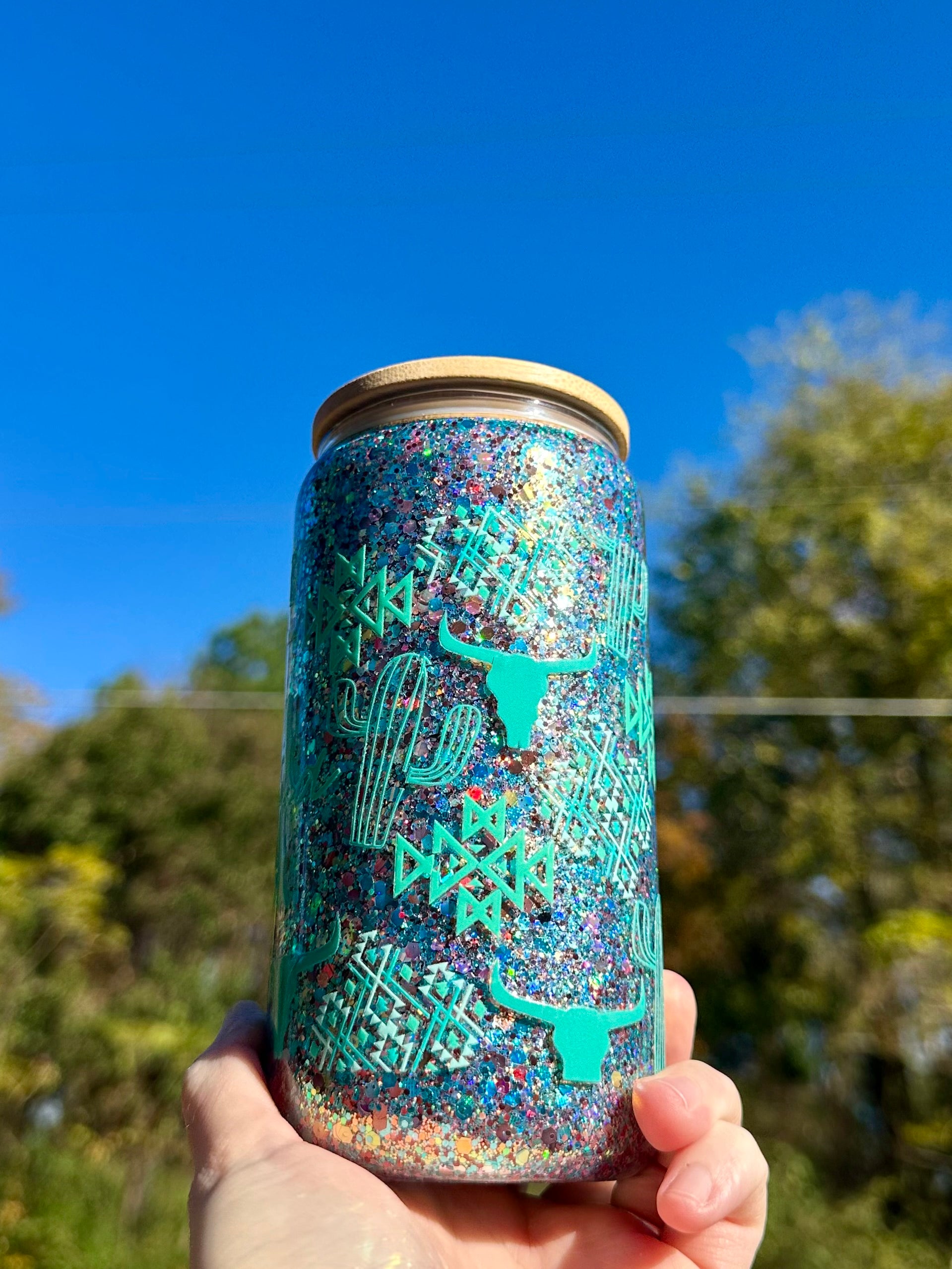 Western themed Mama glass tumbler with brown and teal glitter shift