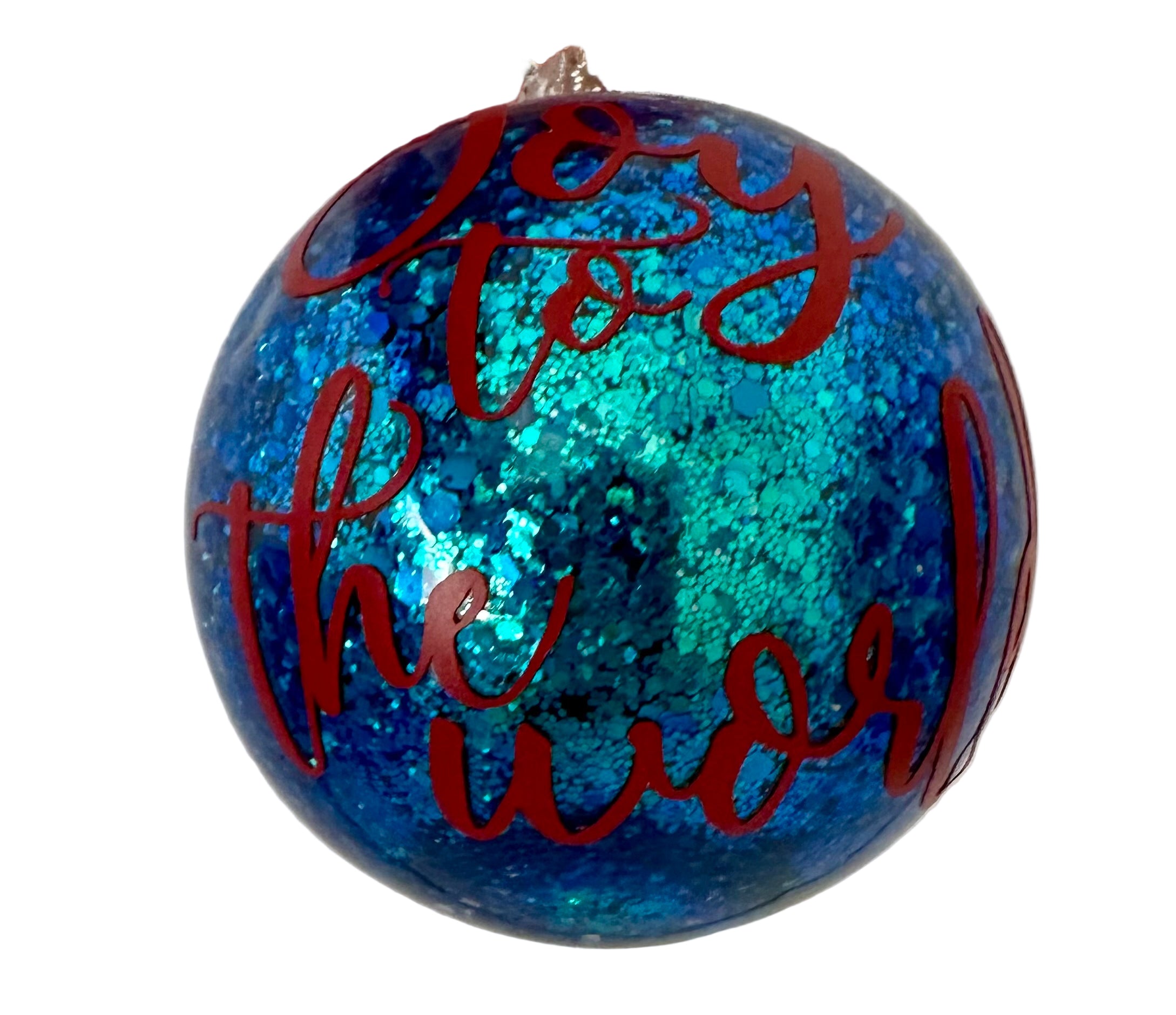 Joy to the World round ornament with blue glitter and red lettering