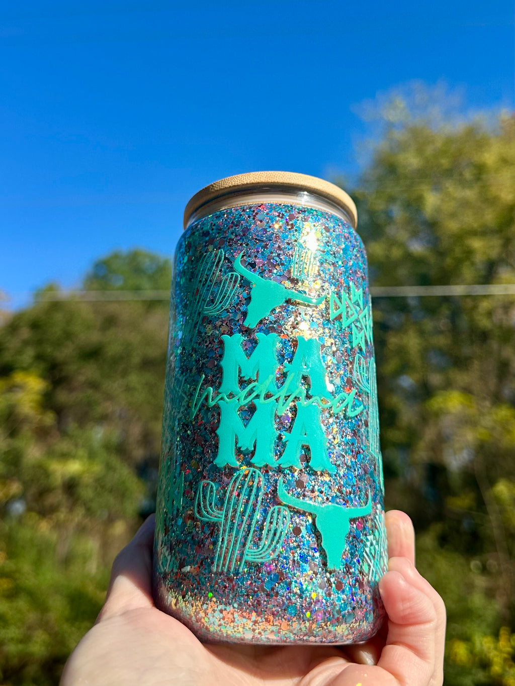 Close-up of Mama glass tumbler with dry glitter finish