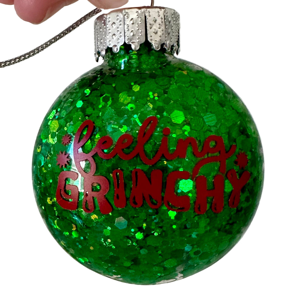 Feeling Grinchy Christmas ornament with green glitter finish